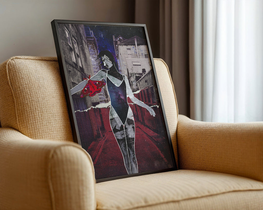 Framed collage artwork of a couple embracing on a city street, displayed on a beige armchair.