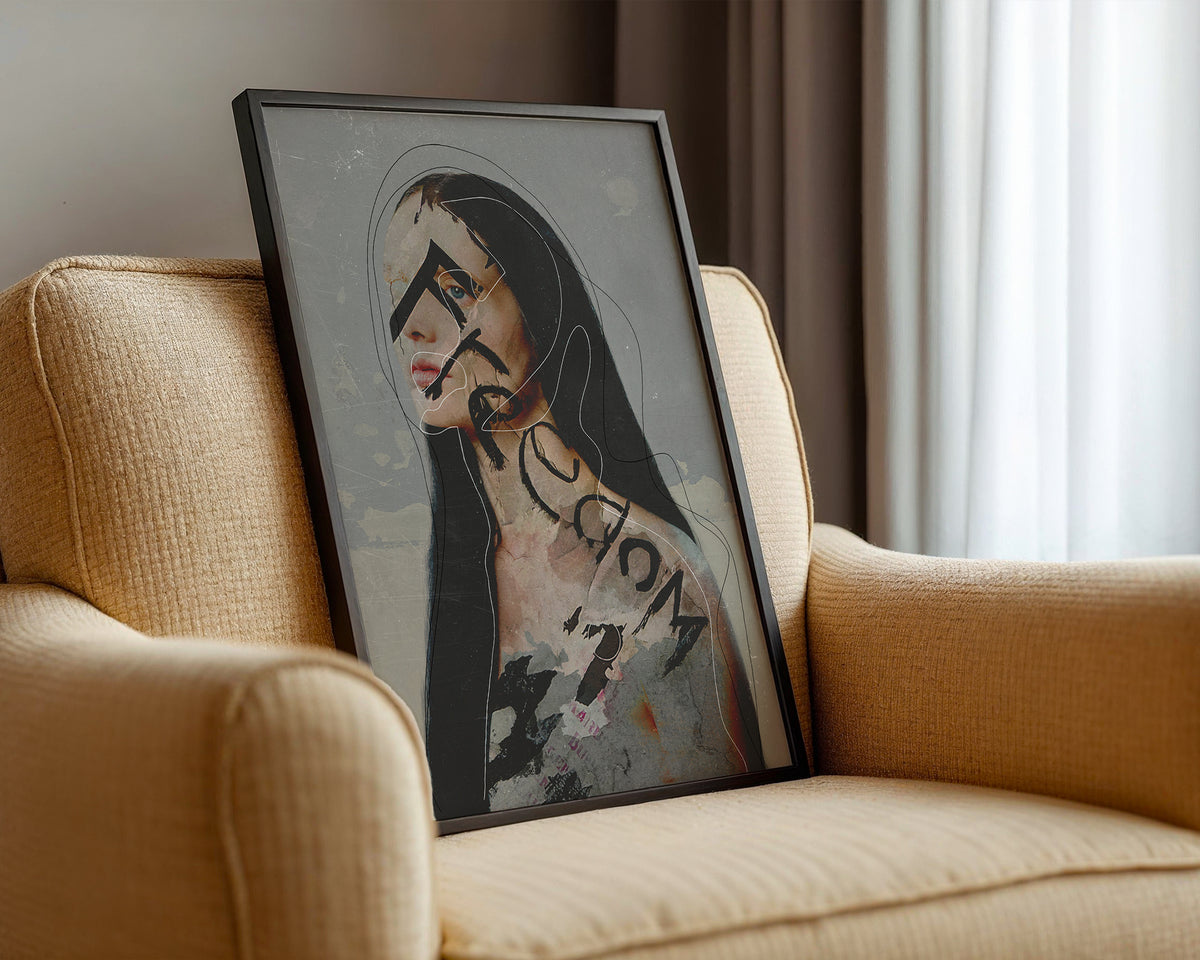 Framed artwork of a woman with text on a beige armchair