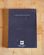 Notebook with starry night design on a wooden surface