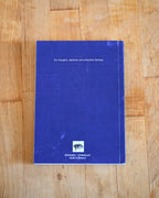 Blue notebook with text on a wooden surface