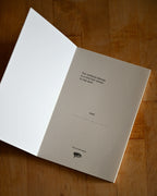 Notebook with text on a wooden surface