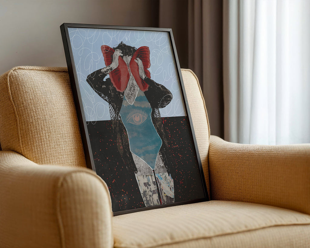 Framed artwork of a woman with a butterfly on a beige armchair.