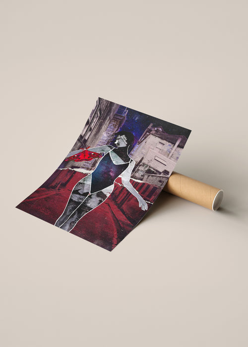 A rolled art print or poster lies on a cardboard tube, partially unrolled to show a stylized collage illustration of a woman and a moth against a dark city-like background.