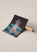 A rolled art print or poster lies on a cardboard tube, partially unrolled to show a surreal collage-style illustration with a blue-clad figure, red accents, a dragonfly and a dark background.