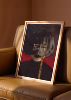 Framed collage artwork with a stylized portrait on a beige sofa