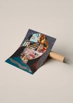A rolled poster or art print lies on a cardboard tube, partially unrolled to reveal a collage-style design of a portrait with text, illustrated figures, and dark blue abstract shapes.