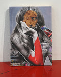 A square canvas art print featuring a surreal collage of a woman with long dark hair, a pizza slice for a face, and bold red and black graphic elements, displayed standing on a glossy red surface against a white wall.